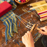 Twisting the ends of handwoven fabric with a fringe twister