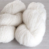 Ashford Boucle Merino brushed yarn beside looped yarn - Thread Collective Australia